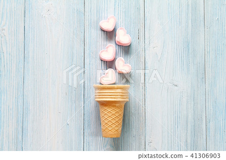 Marshmallows, ice cream cone on wood background Marshmallows, ice cream cone on wood background 41306903