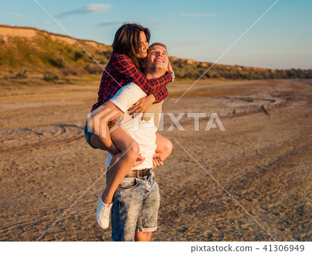 lovestory of couple on the beach On the Sunset 41306949