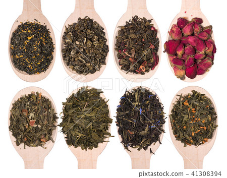 Set of different dry herbal teas in wooden spoons isolated on a white 41308394