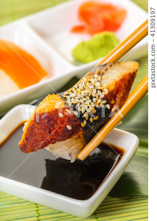 sticks keep sushi with eel in soy sauce 41309197