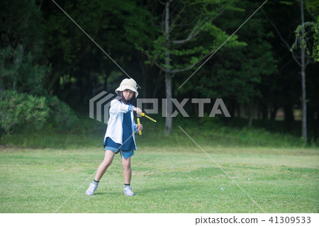 A girl playing with soap bubbles A girl playing with soap bubbles 41309533