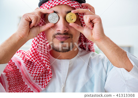 Arab man with bitcoin in cryptocurrency mining concept Arab man with bitcoin in cryptocurrency mining concept 41313308