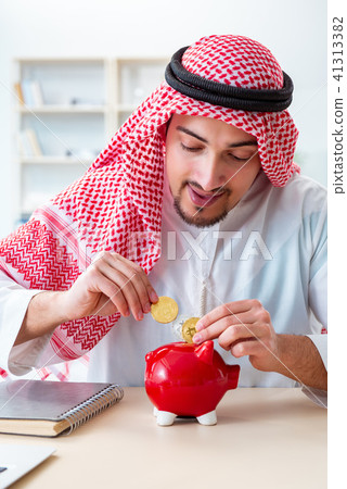 Arab man with bitcoin in cryptocurrency mining concept Arab man with bitcoin in cryptocurrency mining concept 41313382