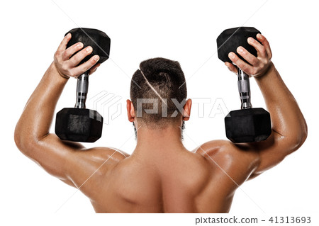 muscular man doing exercises with dumbbells. muscular man doing exercises with dumbbells. 41313693