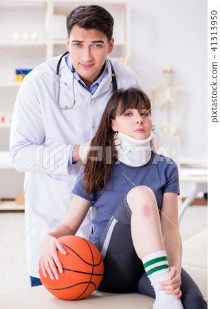 Female basketball player visiting doctor after injury Female basketball player visiting doctor after injury 41313950
