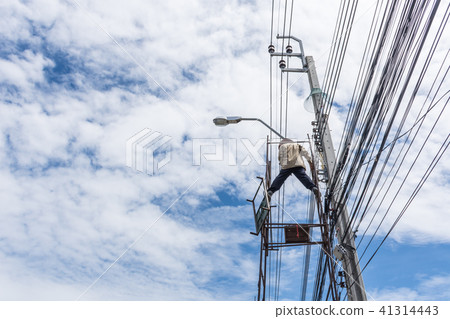 Working to install electric line 41314443