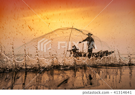 Fishermen using nets to catch fish 41314641