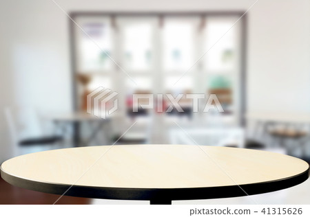 Selected focus empty brown wooden table and Coffee shop blur bac 41315626