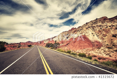 Retro toned picture of a scenic road, USA. 41315672