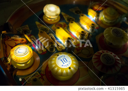 Pinball table close up view of vintage game machine Pinball table close up view of vintage game machine 41315985
