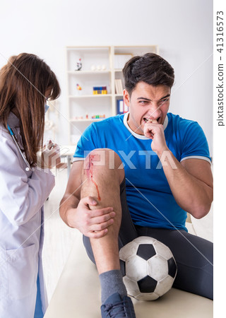 Football soccer player visiting doctor after injury Football soccer player visiting doctor after injury 41316573