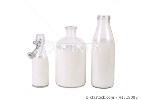 three different bottles of milk 41319098