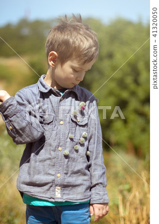 Happy child playing outdoors 41320050