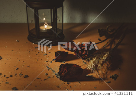 dried red rose flower in a wooden background 41321111