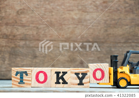 Yellow toy forklift hold block O to word Tokyo Yellow toy forklift hold block O to word Tokyo 41322085