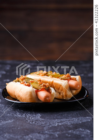 Photo of hotdogs on black plate Photo of hotdogs on black plate 41322226
