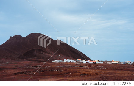 Local village Calhau at the foot of the volcanic crater. Single martian like dry red rock stand out 41322279