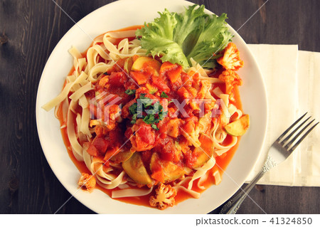 Ribbon pasta with Vegetables and Arrabiata sauce. 41324850