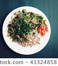 Red rice with mushrooms and tomatoes. Vegan dish. 41324858
