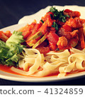 Ribbon pasta with Vegetables and Arrabiata sauce. 41324859