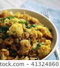 Cauliflower stew with curry. Vegetarian cuisine. 41324860