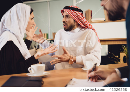 Arab couple at therapist reception quarrel. Arab couple at therapist reception quarrel. 41326268