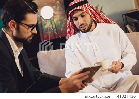 Arabic man at psychotherapist reception 41327430