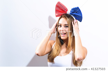 Happy Young woman with ribbon 41327503