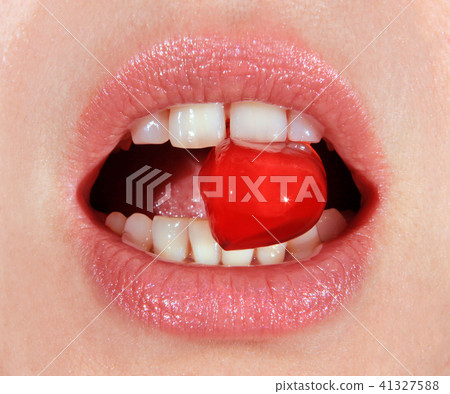 red lollipop in mouth red lollipop in mouth 41327588