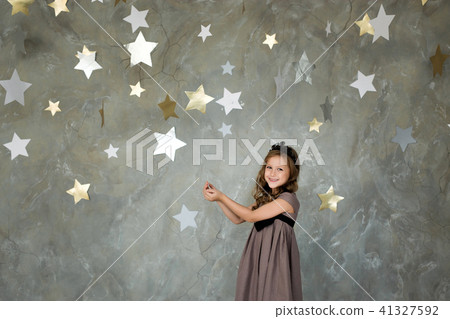 portrait of a happy girl on a background of stars portrait of a happy girl on a background of stars 41327592
