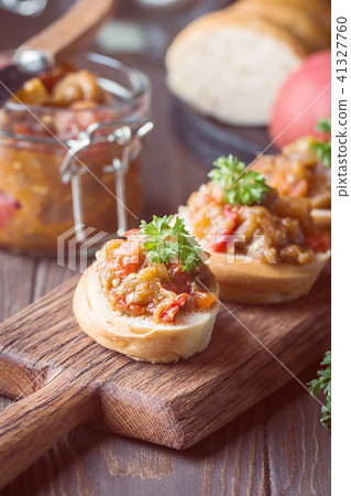Bread toasts with eggplant caviar. 41327760