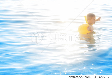 baby in water at the sea with sea armrests baby in water at the sea with sea armrests 41327787