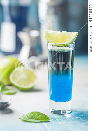 A blue layer alcoholic cocktail 41328446