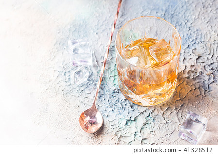 Glass of scotch whiskey 41328512