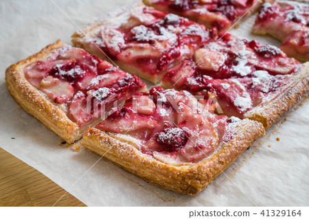 Freshly baked sliced French apple tart Freshly baked sliced French apple tart 41329164