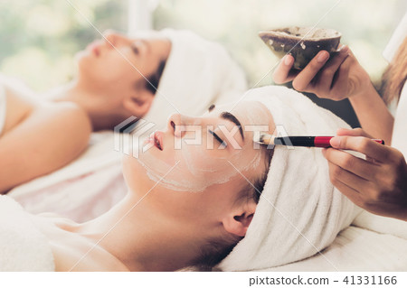 Beautiful woman having a facial treatment at spa. 41331166