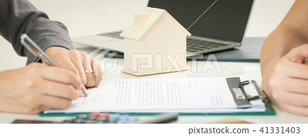 Client Signs Document to Buy House and Real Estate Client Signs Document to Buy House and Real Estate 41331403