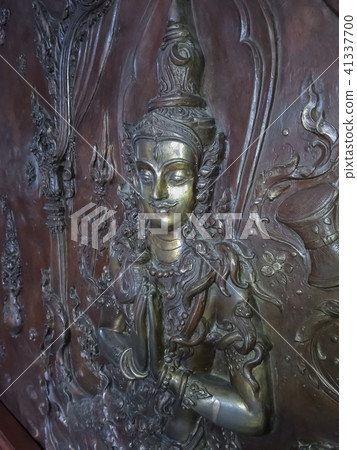 Angel statue on the temple wall. 41337700