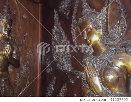 Angel statue on the temple wall. 41337705