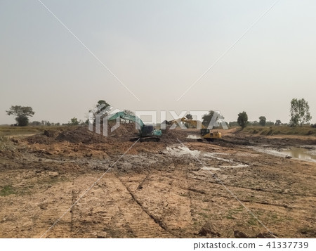 Backhoe is dredging the river 41337739