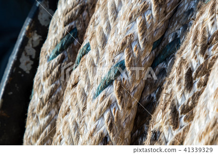 mooring winch mechanism with rope on forward of ship deck on blue sky background 41339329