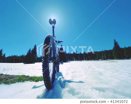 Cycling on large tyres in snow. Biker goes by bike 41341072