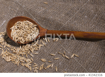 oat grain, wooden spoon, canvas fabric 41342316