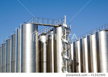 Silver wine Silos with blue sky in background Silver wine Silos with blue sky in background 41342900