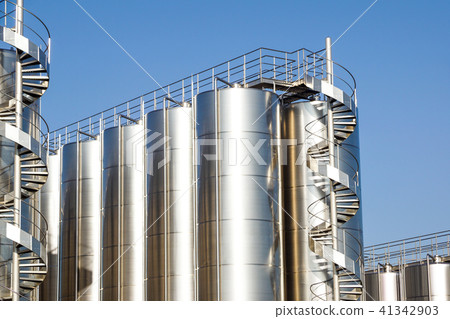 Silver wine Silos with blue sky in background Silver wine Silos with blue sky in background 41342903