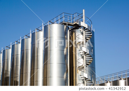 Silver wine Silos with blue sky in background Silver wine Silos with blue sky in background 41342912