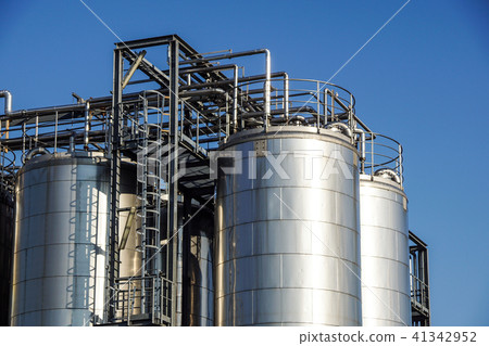 Silver wine Silos with blue sky in background Silver wine Silos with blue sky in background 41342952
