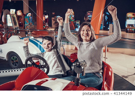 Mother and son in amusement center 41344149