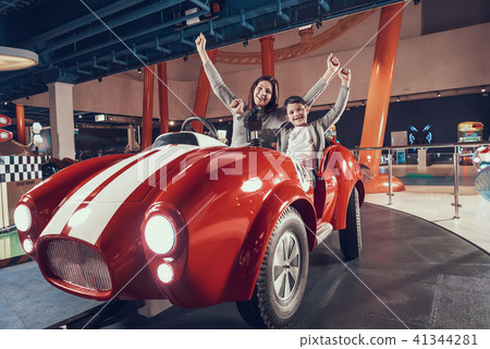 Happy smiling mother and son in amusement center Happy smiling mother and son in amusement center 41344281