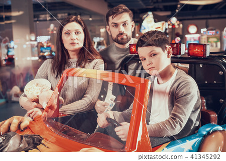 Family, son sitting on toy car Family, son sitting on toy car 41345292